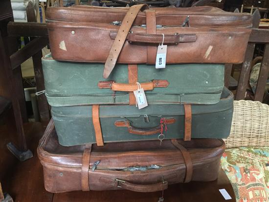 Two leather suitcases and two canvas suitcases